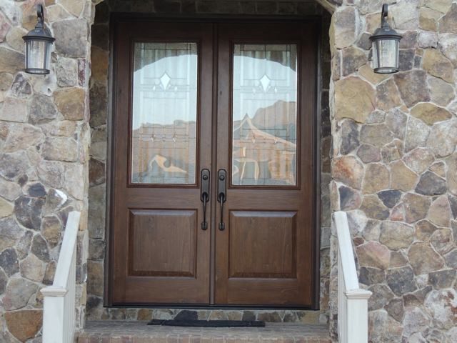 a pair of double doors on a stone building