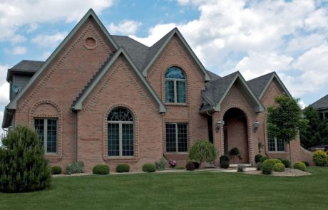 large brick home with single pane windows