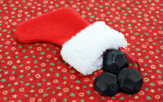A stocking with coal coming out of it