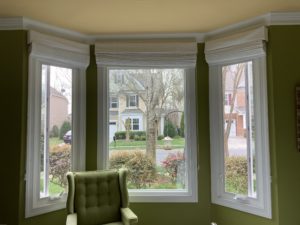 Casement windows flanking a picture window