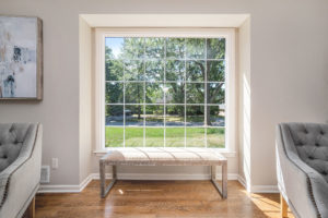 Picture window with grids in a sunny living room